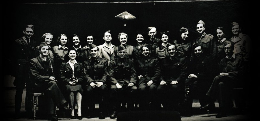 Each of the sixteen elected members of the Slovene National Theatre received his or her decree. From the very beginning only ten were in fact participating. The dramaturge Mile Klopčič left for the headquarters soon after the theatre's founding; Matej Bor moved to the secret base 12-23, known amongst the fighters as »cripplebase«; soon thereafter the singer Anica Čepe also left, while Janez Jerman, Marija Kristančič, Smiljana Samec and Rade Simoniti were taken by the offensive down south and from there across the sea into the Italian town of Bari, while Marta Pavlin-Brina left with Kajuh for the XIV. Division to Styria. The core of the Slovene National Theater was thus made up of the president Filip Kumbatovič, two female actresses Vladoša Simčič and Ema Starc and four male actors Lojze Potokar, France Presetnik, Jože Gale and Jože Tiran of Ljubljana's Drama as well as two female singers Bogdana and Nada Stritar and the male singer Stane Česnik of Ljubljana's Opera.